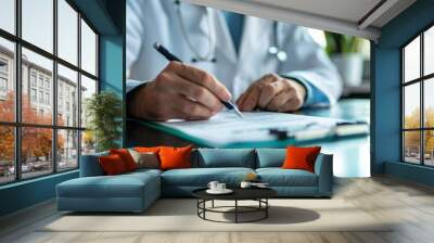 Male doctor's hands filling out patient form while sitting in the clinic Wall mural