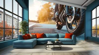 racing motorcycle front wheel on a paved road with space Wall mural