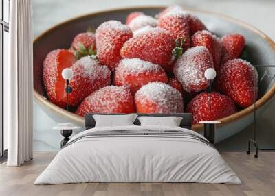 A bowl of ripe, juicy strawberries with a sprinkle of sugar. Wall mural