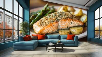 A delicious plate of baked salmon with a crispy herb crust, served with roasted potatoes and a side of asparagus. Wall mural