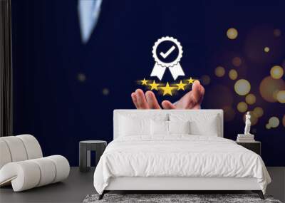 Businessman holding and showing the best quality assurance with golden five stars for guarantee product and ISO service concept.
 Business and technology concept. Wall mural