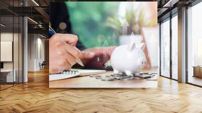 Saving money wealth concept. business hand write management budget for saving cost. saving money wealth and financial concept, Business, investment, Financial planning. payment tax Wall mural