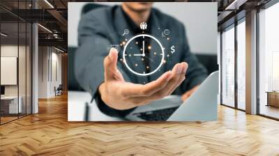 Time management concept. Work planning increases efficiency and reduced work time.  businessman holding clock and money icon on interface virtual for business time management. Wall mural