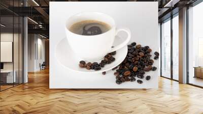 Coffee cup and coffee beans on fabric background. Wall mural