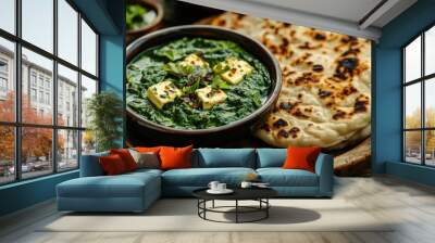 A delicious plate of palak paneer with garlic naan, beautifully garnished and set against a rustic wooden table, highlighting the comfort of homemade Indian dishes. Wall mural