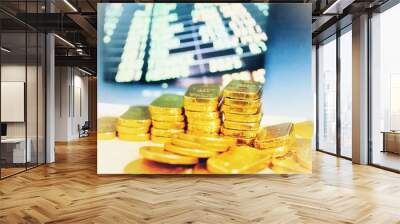 Gold coins placed in the concept of saving, gold investment education Forex trading, stock table background blur Wall mural