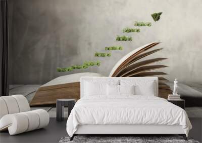 05060626 346 Open book with the pages forming the shape of a growing graph, emphasizing financial knowledge and growth. --ar 16:9 Job ID: 09e628ff-5e91-4d29-98f3-0bf69fdab645 Wall mural