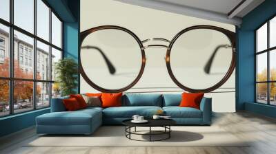 Vintage Round Eyeglasses on Plain Background Wall mural