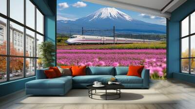 Shinkansen JR Bullet train go through Mt. Fuji and pink alpine milk-vetch flowers and blue sky, Fuji. Famous transportation to transit between Tokyo to Osaka Wall mural