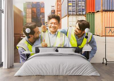 Good work : Senior and young male workers workers working in teams and teamwork coworkers in warehouse container engineering department maintenance work with happy people friendly. Wall mural