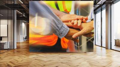 Team multi-ethnic workers, men and women, join hands to join forces to join forces to work for the industry for success. Teamwork and professional colleagues : Workers' hands, teamwork concept. Wall mural