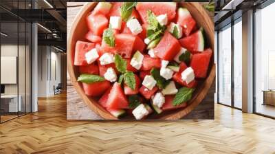 A top-down shot of a refreshing watermelon and feta salad with mint leaves, perfect for a light and cooling summer meal. Wall mural