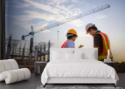 Construction engineer talks to the architect on the construction site. To describe home design work Wall mural