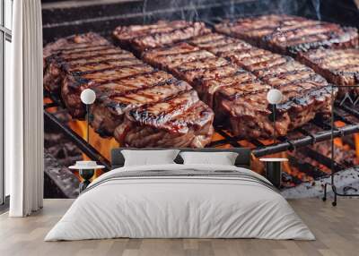 The meat is grilled over a hot fire on the grill. Wall mural