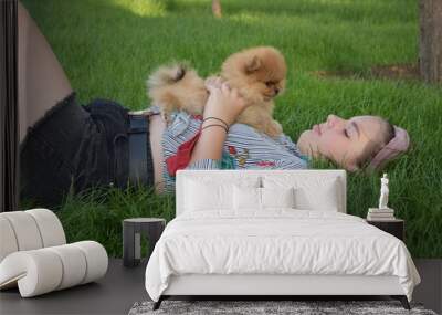 girl with puppy in the park Wall mural