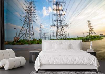 Highway with large high voltage towers under the blue sky white clouds Wall mural