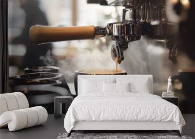 Close-up of an espresso machine with steam rising from a coffee cup, focusing on a black mug being filled, set against a cozy cafe interior background with blurred tables and chairs. Wall mural