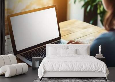 Close-Up of Woman Typing on MacBook Laptop with Blank Screen, Sitting at Wooden Desk in Home Office on Sunny Day, Featuring Bokeh Effect Wall mural