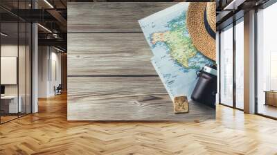 Travel Plan on Wooden Background with Camera, Map, and Hat, Ideal for Vacation Planning and Travel Promotions Wall mural