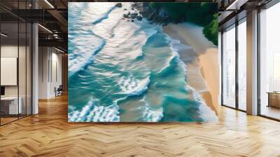 Breathtaking aerial view of tranquil beach with shimmering sunlight reflecting on waves gently crashing onto the sandy shore, embodying serenity and coastal beauty. Wall mural