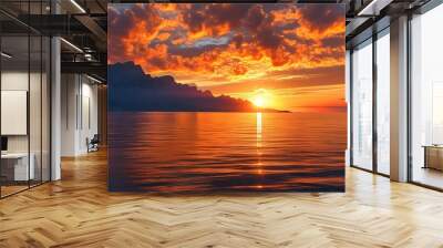 Breathtaking sunset and sunrise over the sea, featuring vibrant orange clouds, silhouetted mountains, and radiant sun rays reflecting on tranquil waters Wall mural