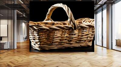 Elegant woven wicker basket with handle against a sleek black background Wall mural