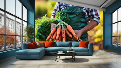 Farmer-gardener proudly presents freshly harvested garden carrots Wall mural