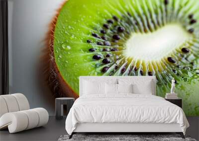 Fresh kiwi fruit cut sections, moist flesh, evenly distributed seeds, bright colors. Wall mural