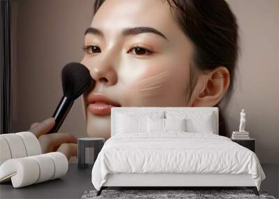 Intimate close-up of woman skillfully applying makeup using a facial brush Wall mural