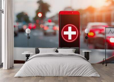 Red cell phone featuring a cross design resting on a table surface Wall mural