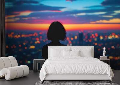 Reflections of a Soul: A Womans Silhouette Contemplating Life Against a Bright Urban Skyline Wall mural