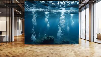 Serene underwater scene with rising bubbles in deep blue ocean, evoking the tranquility and mystery of aquatic life Wall mural