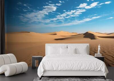 Tranquil desert expanse of vast sand dunes beneath a clear blue sky showcasing the serene beauty of nature Wall mural