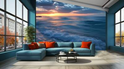 Tranquil seascape at dusk with gentle waves, expansive ocean, and serene horizon meeting a picturesque sky Wall mural