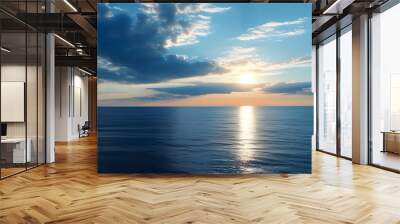 tranquil seascape at sundown with vibrant blue sky and golden sun reflecting on the serene waters Wall mural