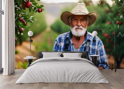 Weathered hands of an elder tending to the orchard with care and devotion Wall mural