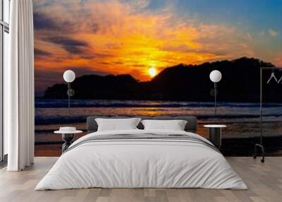 Beautiful sunset seen from the beach Wall mural