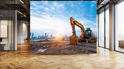 excavator in construction site on sunset sky background Wall mural