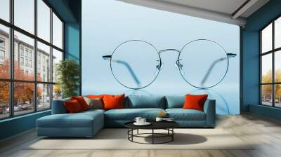 glasses on blue background Wall mural