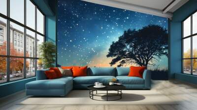 The silhouette of trees under the starry sky, the stars are dotted, and the night sky is peaceful and beautiful. Wall mural