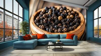 Aromatic black peppercorns in a wooden bowl against a rustic wooden backdrop, highlighting the spices rich color, texture, and enticing aroma. Wall mural