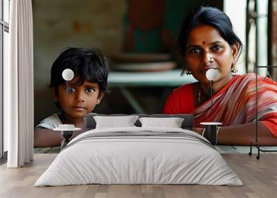 Bonding Moments: Indian Woman and Child Sharing a Table Surrounded by Tradition Wall mural