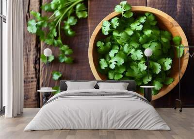 Cilantro Elegance: A Top-Down Perspective of Fresh Greens in a Rustic Wooden Bowl Wall mural