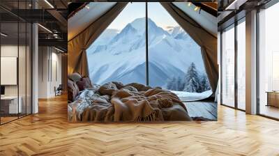 Cozy glamping tent featuring luxurious bedding and rustic decor with breathtaking mountain views in a snowy landscape Wall mural