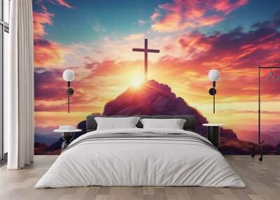 Dramatic sunset illuminating a cross atop a mountain with swirling clouds, symbolizing the connection between spirituality and the beauty of nature Wall mural