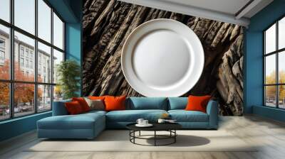 Elegant white plate on rustic wooden surface, highlighting the contrast between smooth porcelain and textured dark wood Wall mural