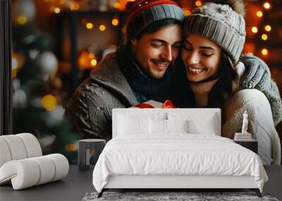 Festive joy as a couple shares love and a Christmas gift in a cozy holiday atmosphere Wall mural