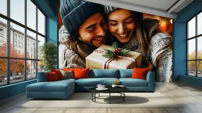 Festive joy as a couple shares love and a Christmas gift in a cozy holiday atmosphere Wall mural