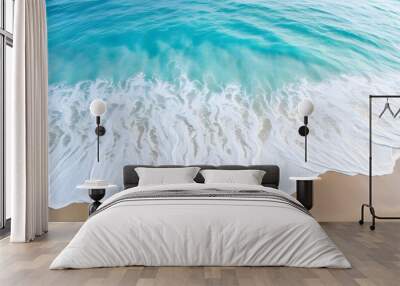 gentle waves lapping at the shore under a clear sky Wall mural