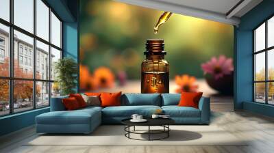 Golden elixir flowing from a dropper into a dark glass bottle, surrounded by a dreamy natural backdrop, embodying the spirit of holistic wellness and natural remedies. Wall mural